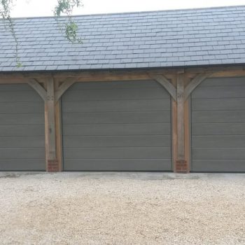 Three Grey Sectional Garage Doors