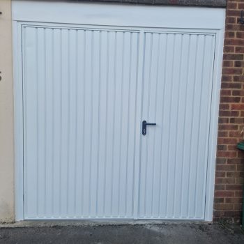white garage door with front door