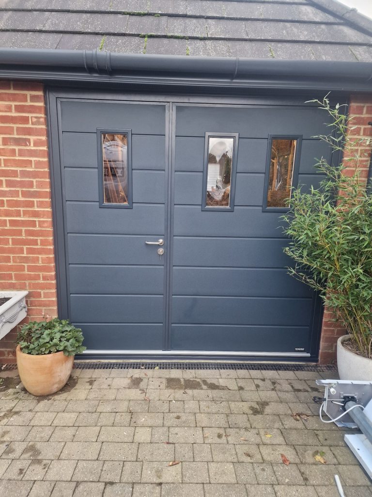 dark grey garage door with front entrance door